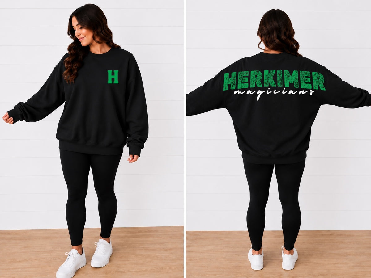 That Sweatshirt Girl black crewneck sweatshirt with green Herkimer Magicians graphic, worn by a woman with leggings.